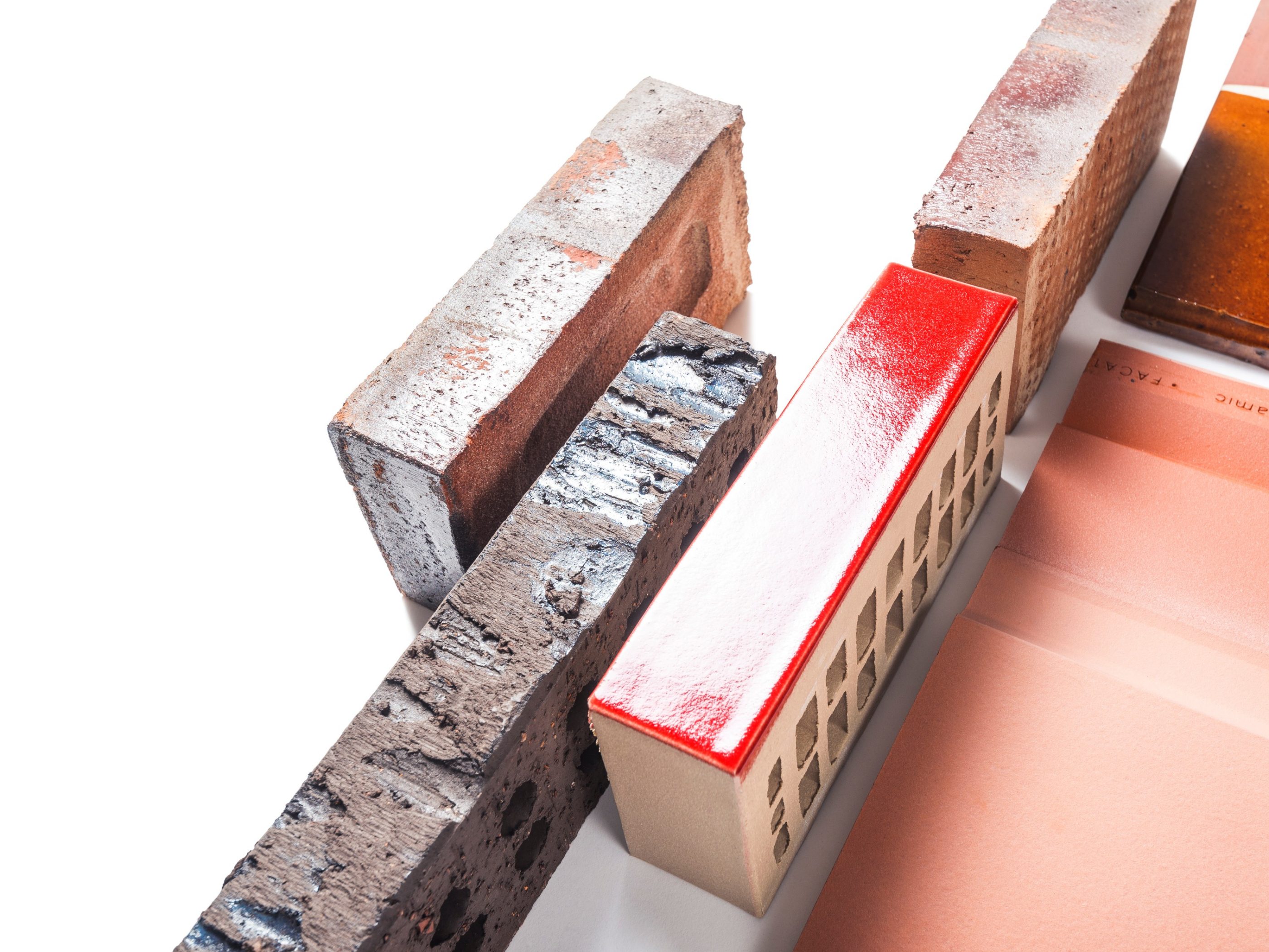 Product shot of facing bricks with a glazed roof tile